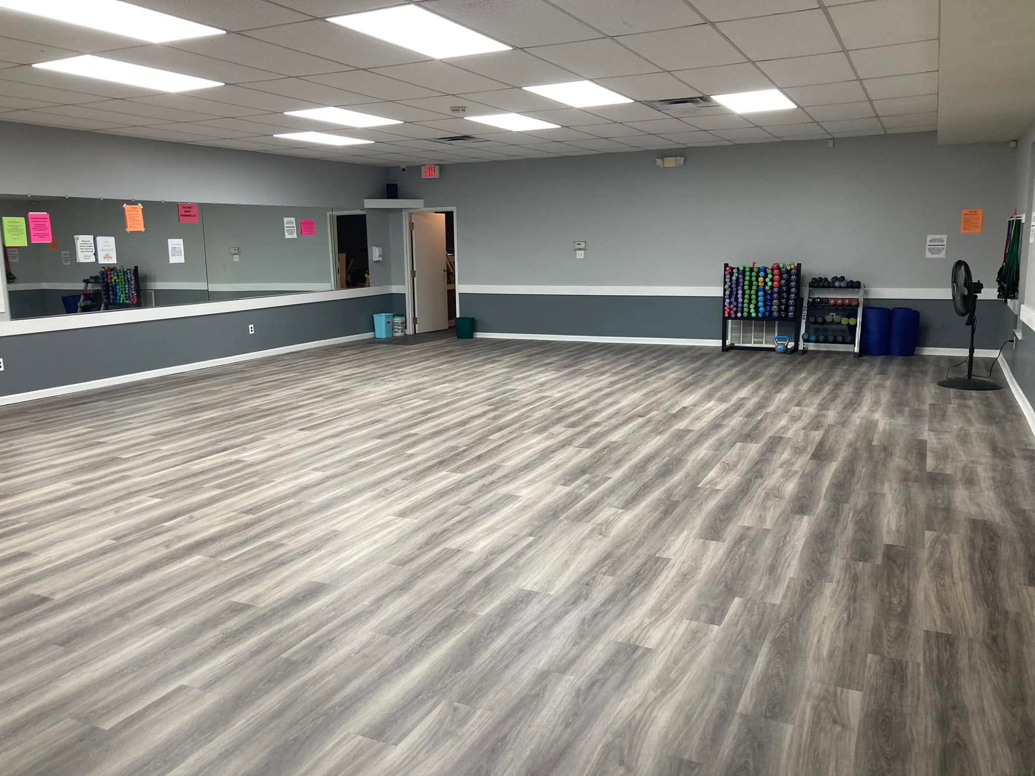The group exercise studio — mirrored wall and open floor