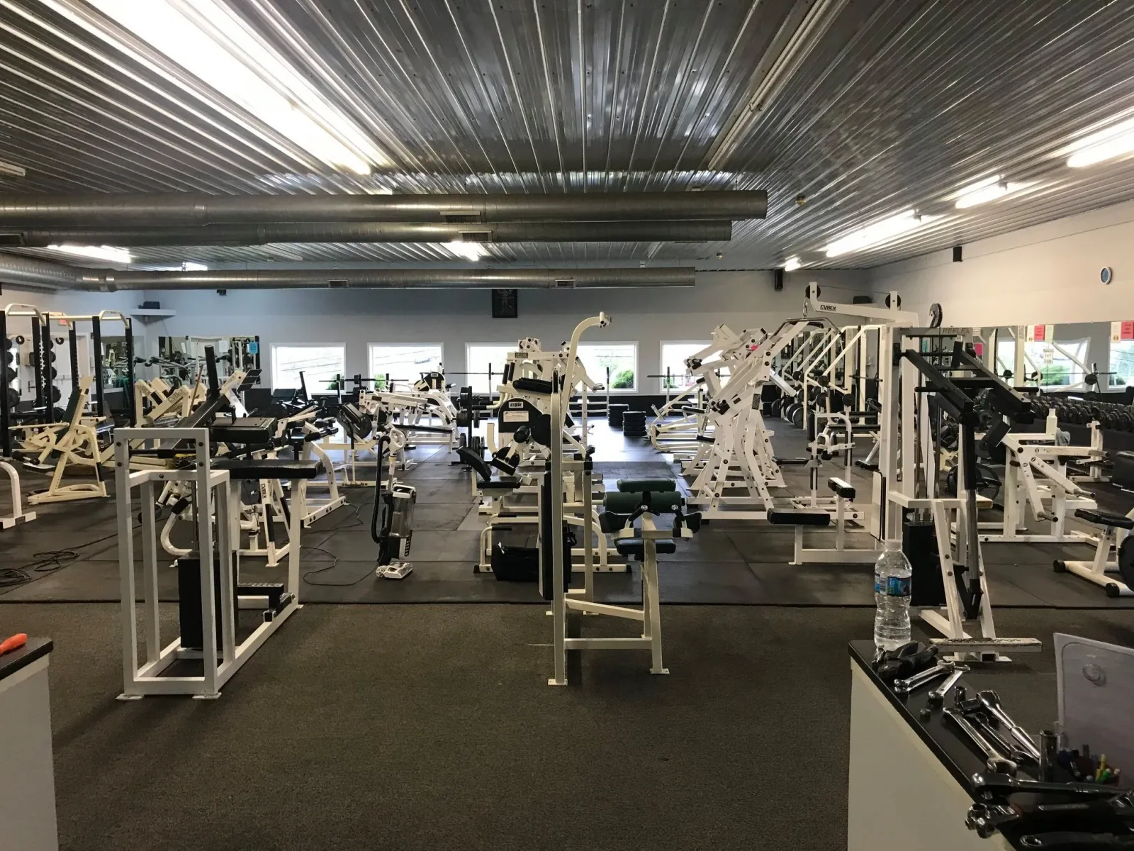 The main weight floor at Webb's — racks, benches, and plate-loaded machines wall to wall